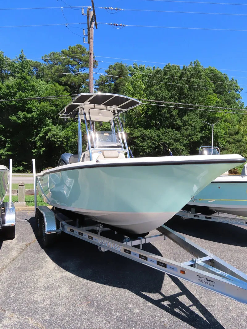 Slide: The Image of 2024 Key West 203 FS boat on trailer, parked outdoors. - 4