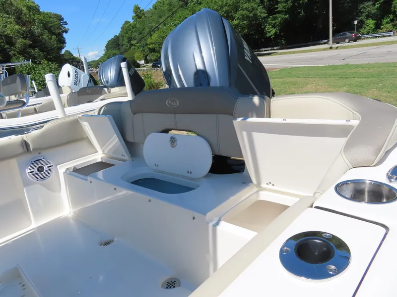 Slide: The Image of 2024 Key West 203 FS boat interior with seating and storage compartments. - 6
