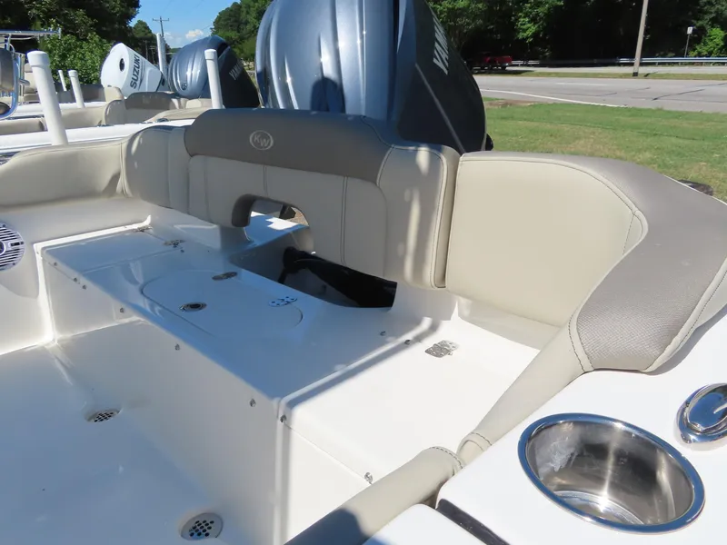 Slide: The Image of 2024 Key West 203 FS boat interior with seating and cup holder. - 7