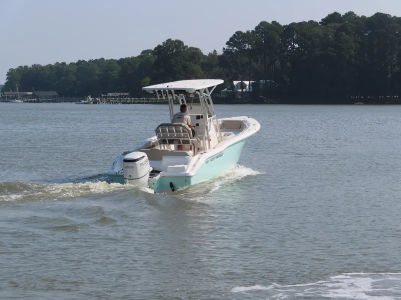 Slide: The Image of 2024 Key West 203 FS boat cruising on a calm lake. - 9