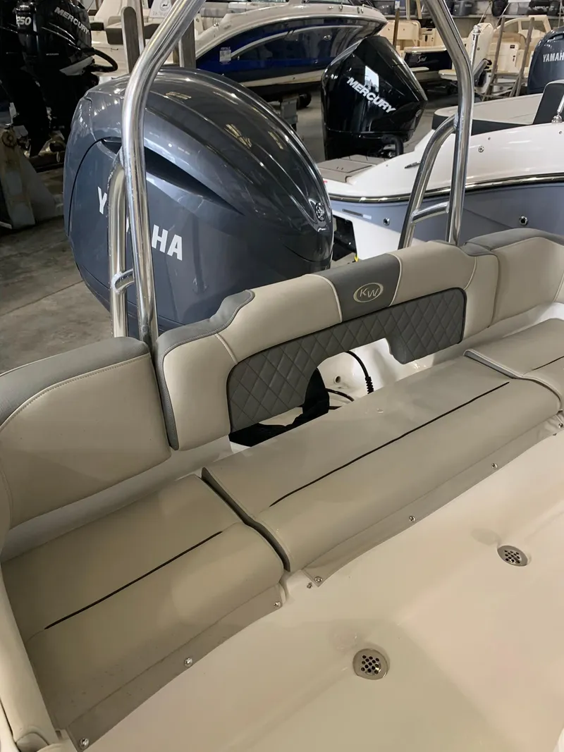 Slide: The Image of 2025 Key West 203 FS boat interior with Yamaha engine in showroom. - 10