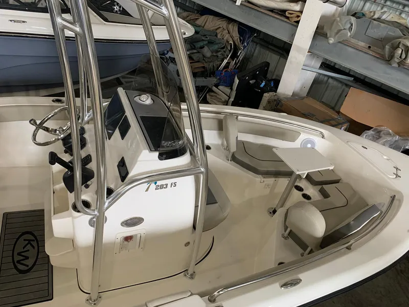 Slide: The Image of 2025 Key West 203 FS boat interior with console and seating. - 12