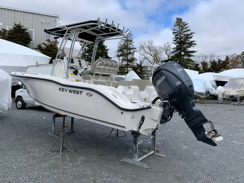 Slide: The Image of 2025 Key West 203 FS boat with Yamaha engine on display outdoors. - 3