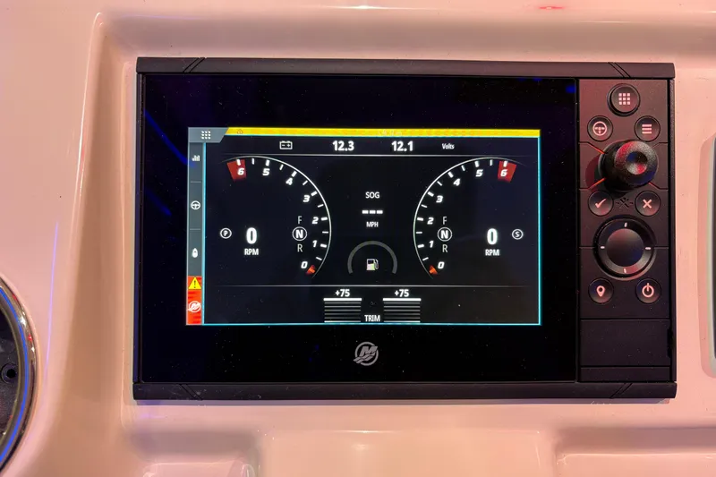 Slide: The Image of Dashboard display of 2026 Scout 330 LXF boat showing RPM and voltage gauges. - 29