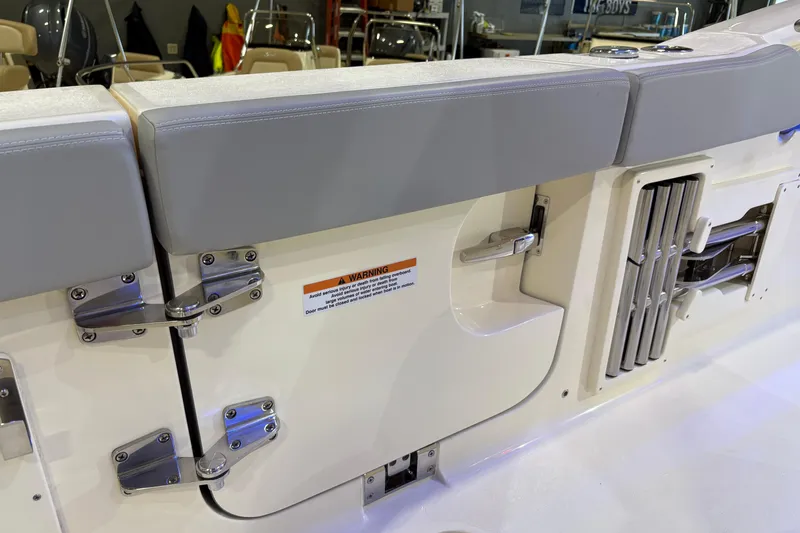 Slide: The Image of 2026 Scout 330 LXF boat interior with cushioned seating and stainless steel hardware. - 35