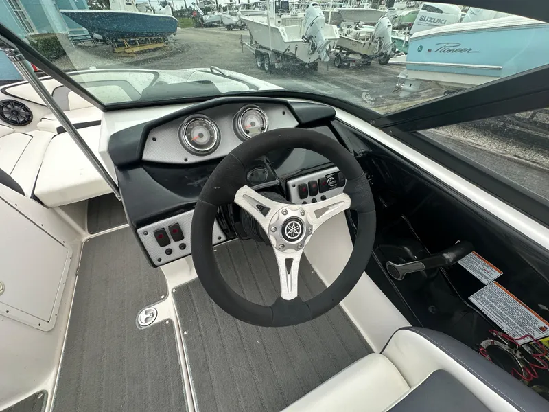 Slide: The Image of 2015 Yamaha Boats SX192 dashboard and steering wheel, showcasing sleek design and controls. - 11