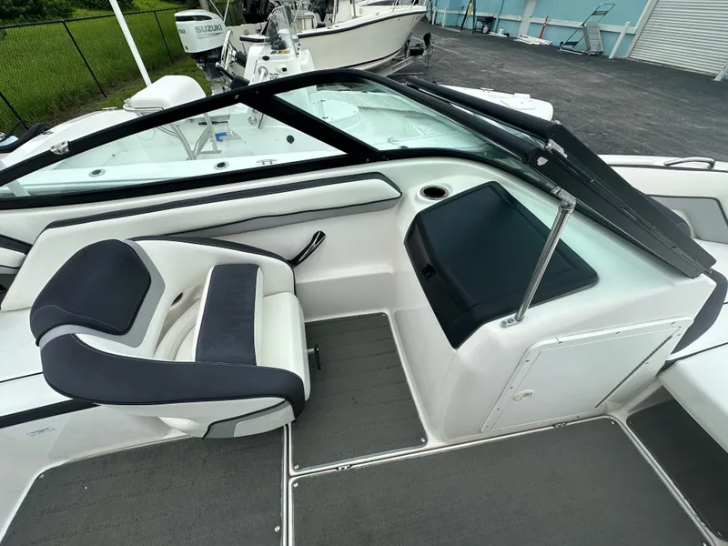 Slide: The Image of 2015 Yamaha Boats SX192 interior with sleek seating and dashboard. - 13
