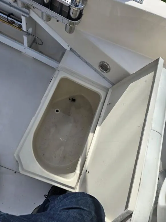 Slide: The Image of Open storage compartment on 1988 Grady-White 232 Gulfstream boat deck. - 5