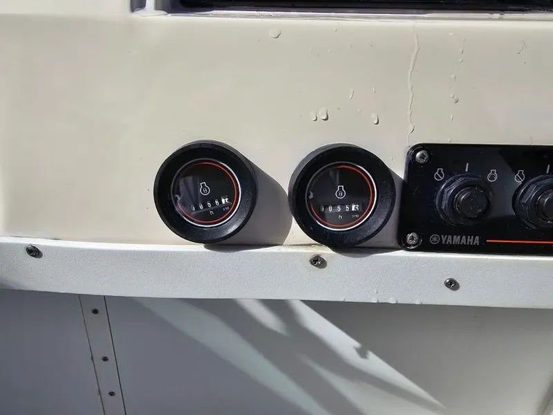 Slide: The Image of Close-up of Yamaha gauges on a 1988 Grady-White 232 Gulfstream boat. - 6