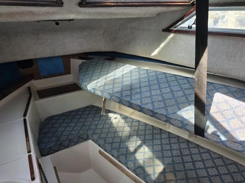 Slide: The Image of Interior cabin of 1988 Grady-White 232 Gulfstream boat with patterned cushions. - 7