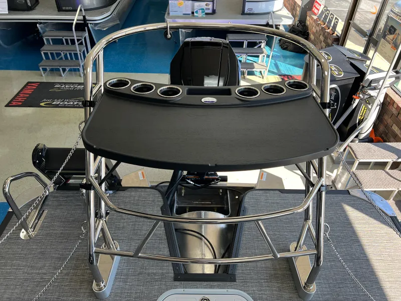 Slide: The Image of 2025 Crest Caribbean LX 230 SLRC boat interior with sleek design and cup holders. - 17