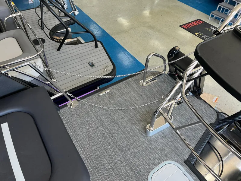 Slide: The Image of 2025 Crest Caribbean LX 230 SLRC boat interior with sleek seating and modern design. - 18