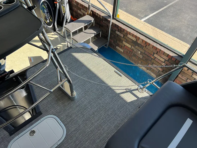 Slide: The Image of 2025 Crest Caribbean LX 230 SLRC boat interior with modern seating and sleek design. - 19