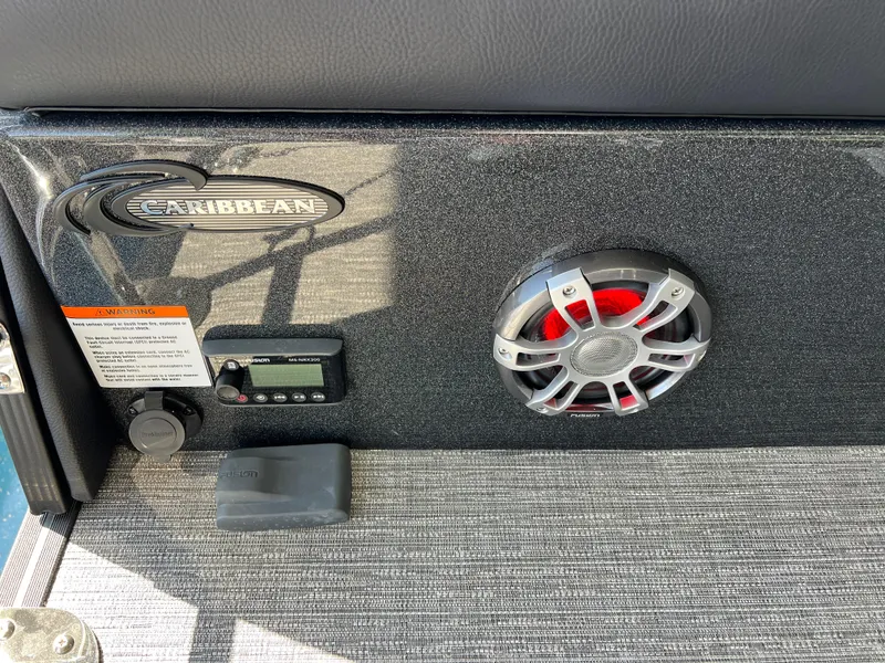 Slide: The Image of 2025 Crest Caribbean LX 230 SLRC boat interior with speaker and control panel. - 21