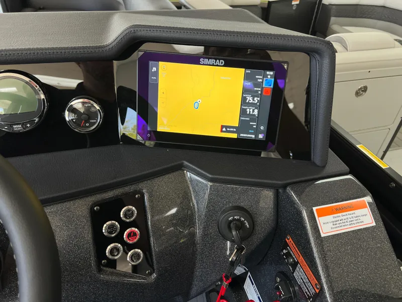 Slide: The Image of Dashboard of 2025 Crest Caribbean LX 230 SLRC with Simrad navigation display. - 28