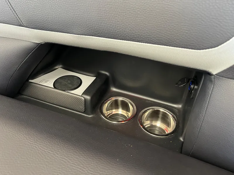 Slide: The Image of 2025 Crest Caribbean LX 230 SLRC interior cup holders and storage compartment. - 33