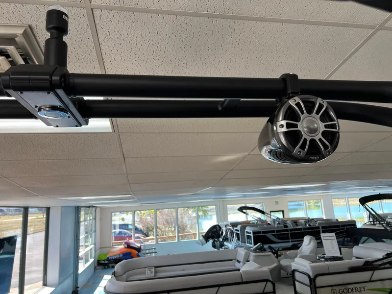 Slide: The Image of 2025 Crest Caribbean LX 230 SLRC boat speaker in showroom. - 36