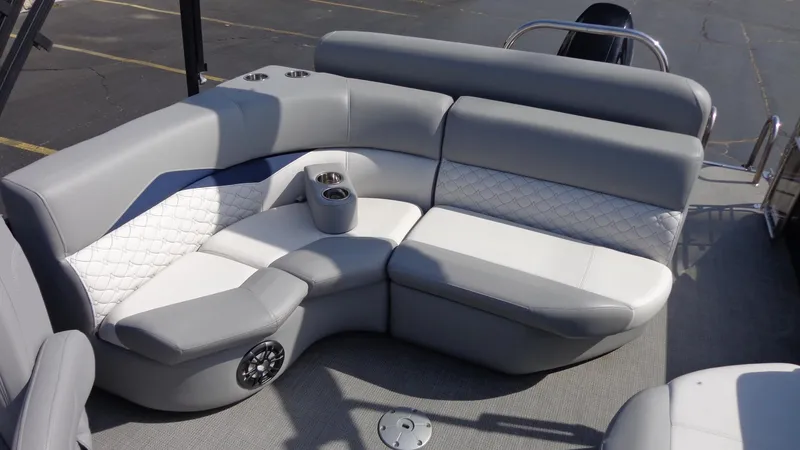 Slide: The Image of 2022 Manitou 23 SES Bench with gray and white seating, cup holders, and speaker. - 10