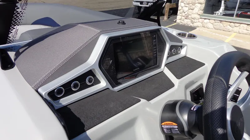 Slide: The Image of 2022 Manitou 23 SES Bench dashboard with modern controls and steering wheel. - 15