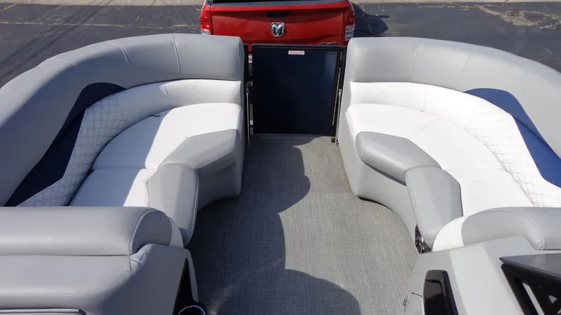 Slide: The Image of 2022 Manitou 23 SES Bench interior with gray and white seating. - 21