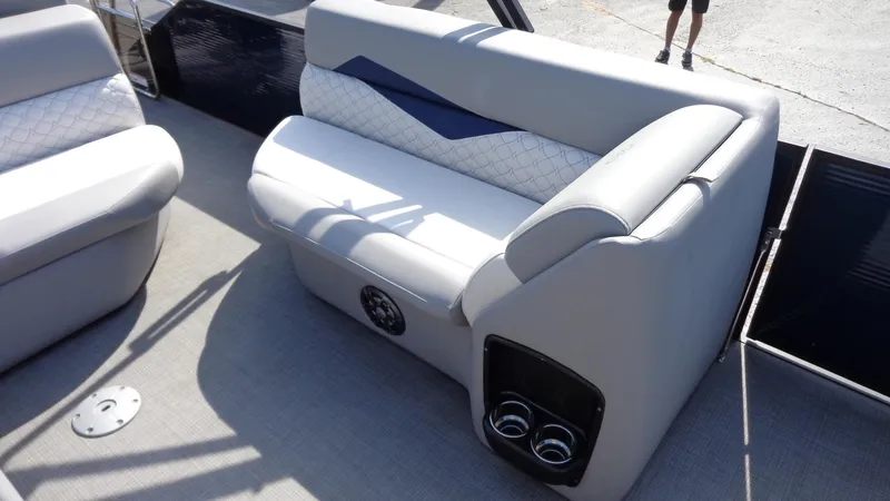 Slide: The Image of 2022 Manitou 23 SES Bench boat seat with cup holders and speaker. - 25