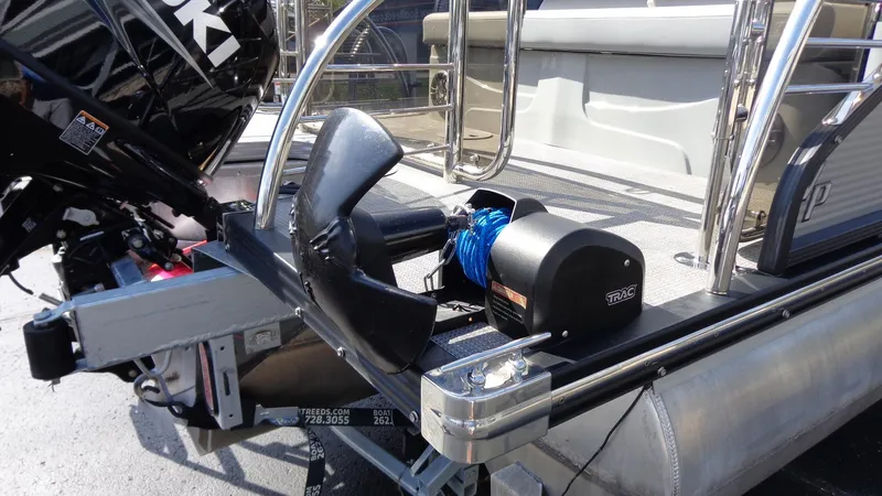 Slide: The Image of 2022 Manitou 23 SES Bench pontoon boat with motor and winch. - 3