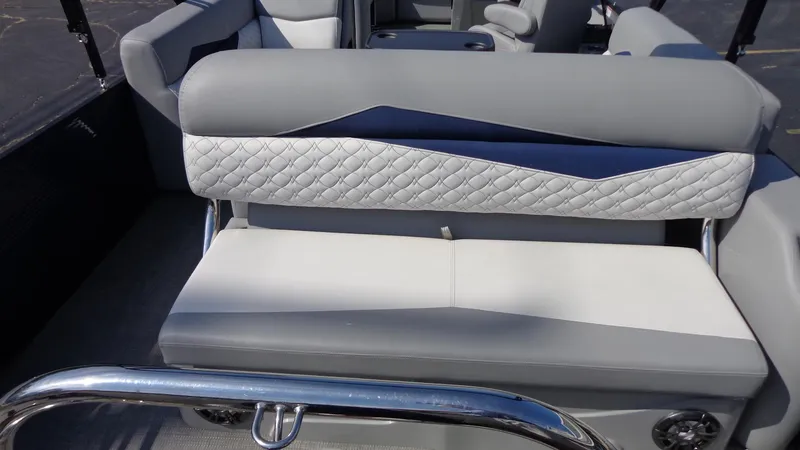 Slide: The Image of 2022 Manitou 23 SES Bench with stylish gray and white seating. - 4