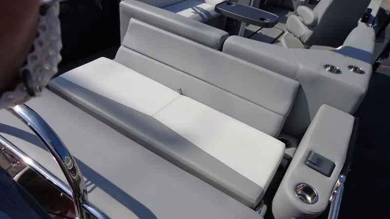 Slide: The Image of 2022 Manitou 23 SES Bench with gray seating and cup holders. - 6