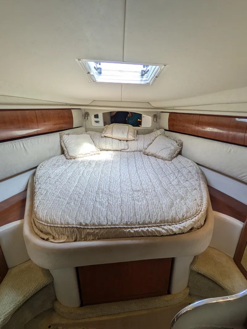 Slide: The Image of 2004 Sea Ray 360 Sundancer cabin with cozy bed and skylight. - 16