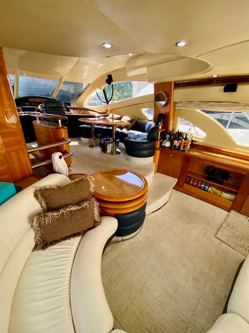 Slide: The Image of Luxurious interior of a 2002 Azimut 55 yacht with elegant seating and modern amenities. - 39