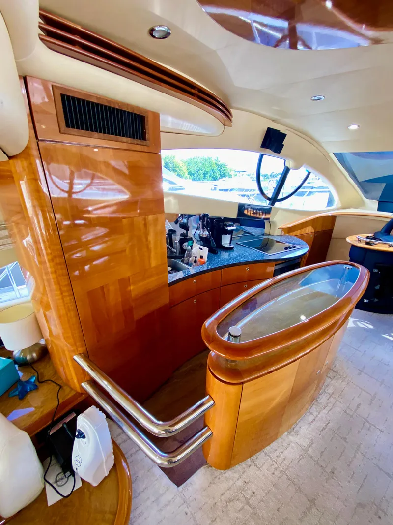 Slide: The Image of Luxurious interior of a 2002 Azimut 55 yacht with polished wood finishes. - 44