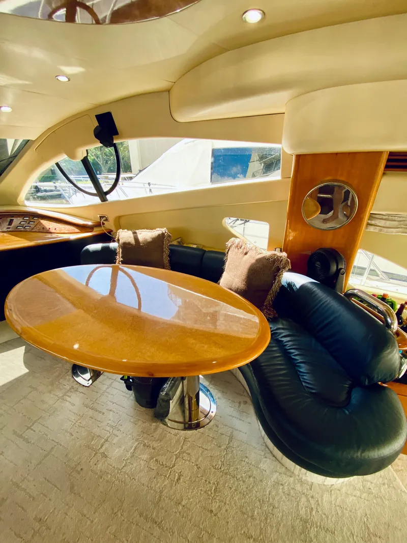 Slide: The Image of Luxurious interior of a 2002 Azimut 55 yacht with elegant seating and table. - 46