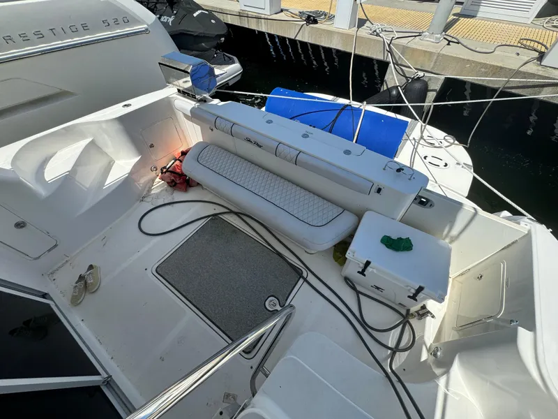 Slide: The Image of 2008 Sea Ray 44 Sedan Bridge yacht deck with seating and storage. - 10