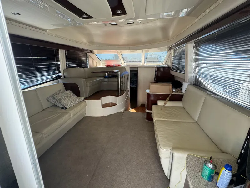 Slide: The Image of Luxurious interior of 2008 Sea Ray 44 Sedan Bridge yacht with beige seating. - 11
