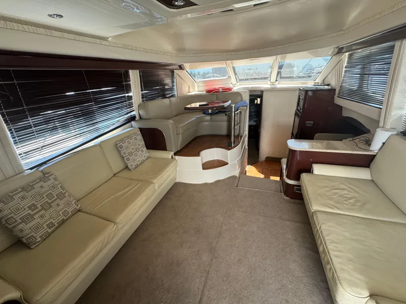 Slide: The Image of Luxurious interior of 2008 Sea Ray 44 Sedan Bridge yacht with plush seating. - 12