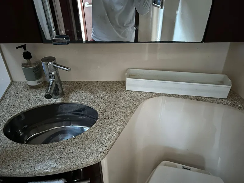 Slide: The Image of Luxurious bathroom in 2008 Sea Ray 44 Sedan Bridge yacht with granite countertop. - 29