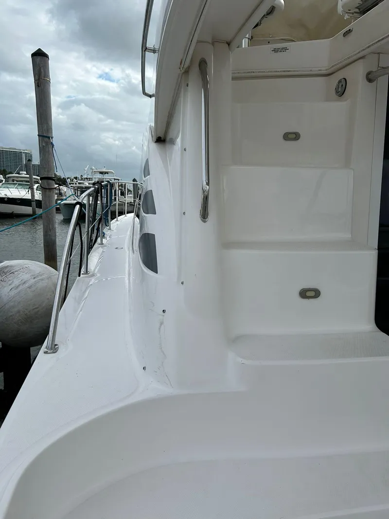 Slide: The Image of 2008 Sea Ray 44 Sedan Bridge yacht docked at marina. - 41