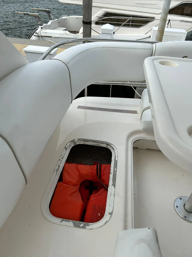 Slide: The Image of 2008 Sea Ray 44 Sedan Bridge yacht deck with storage compartment and seating. - 47