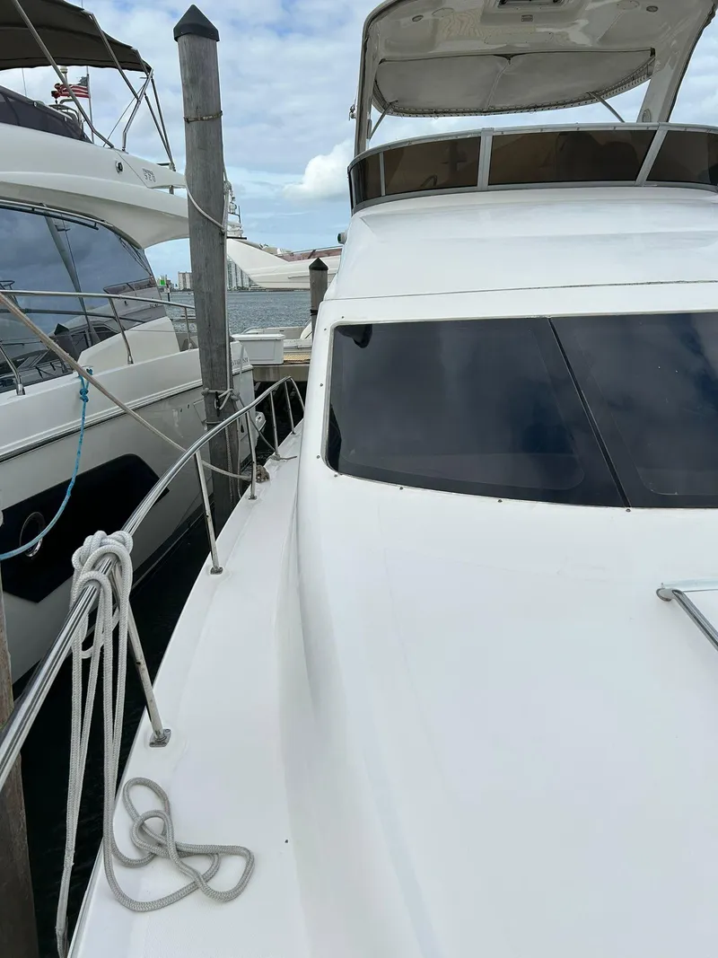 Slide: The Image of 2008 Sea Ray 44 Sedan Bridge yacht docked at marina. - 8