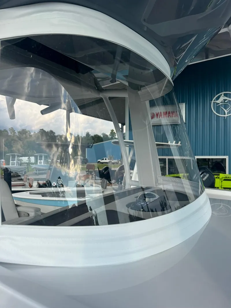 Slide: The Image of 2025 Bluewater 25 T boat with sleek design and modern features. - 13