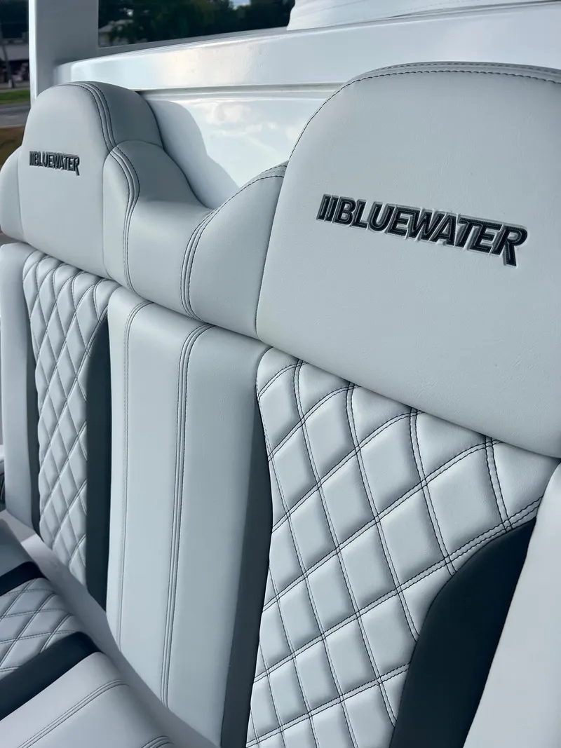 Slide: The Image of 2025 Bluewater 25 T boat seats with quilted design and logo embroidery. - 15