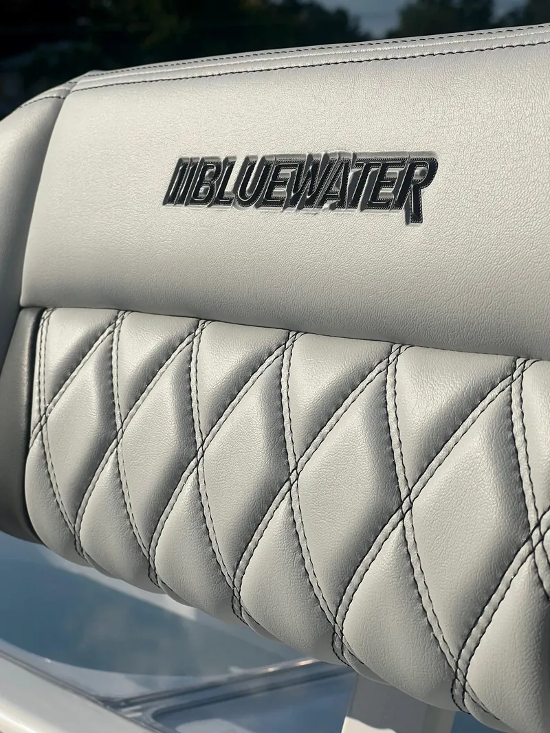 Slide: The Image of Bluewater 25 T 2025 boat seat with quilted leather design. - 16