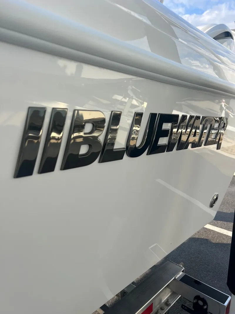 Slide: The Image of 2025 Bluewater 25 T boat logo on white hull. - 3