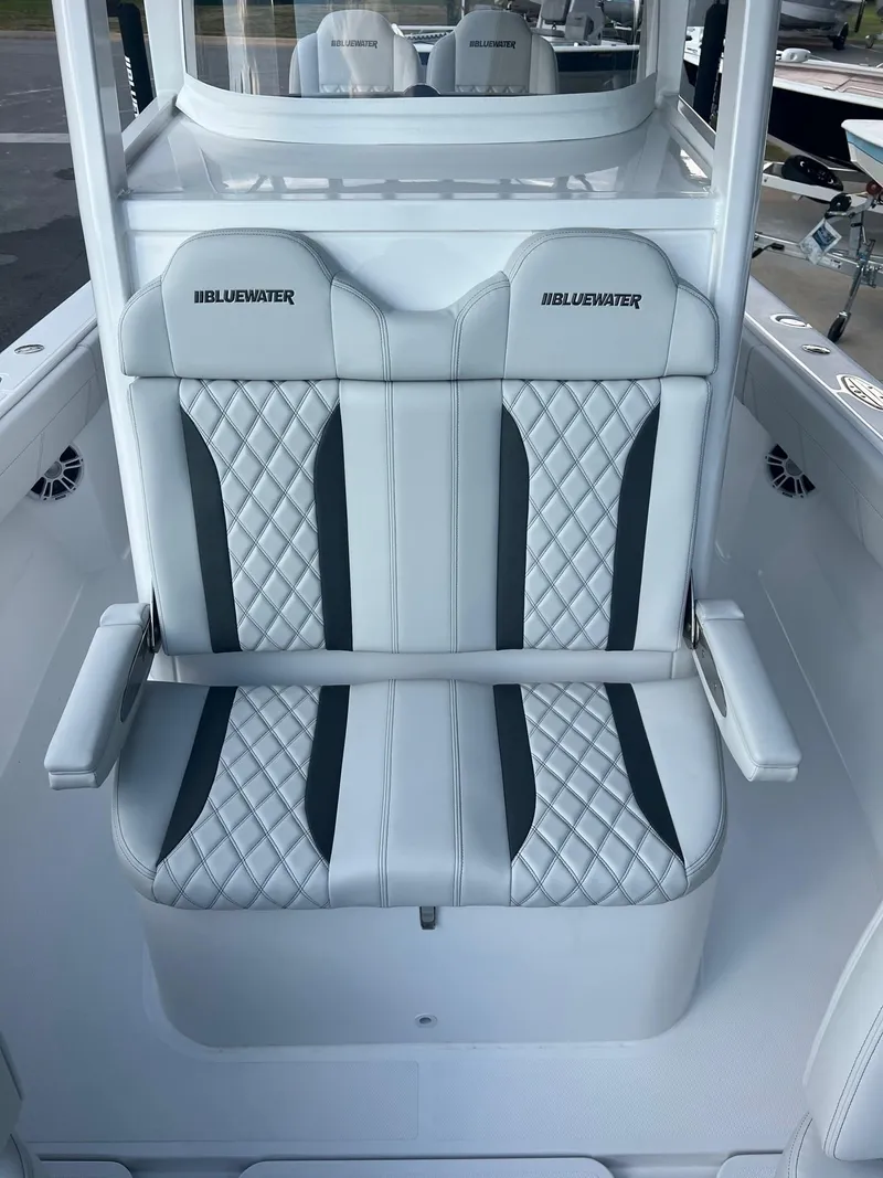 Slide: The Image of 2025 Bluewater 25 T boat with stylish, quilted seating and armrests. - 7