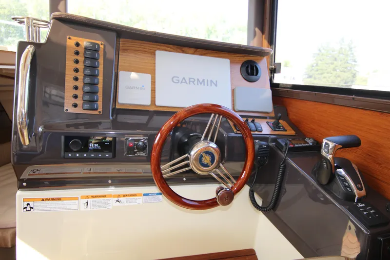Slide: The Image of 2023 Ranger Tugs R-27 Luxury Edition helm with Garmin navigation system. - 13