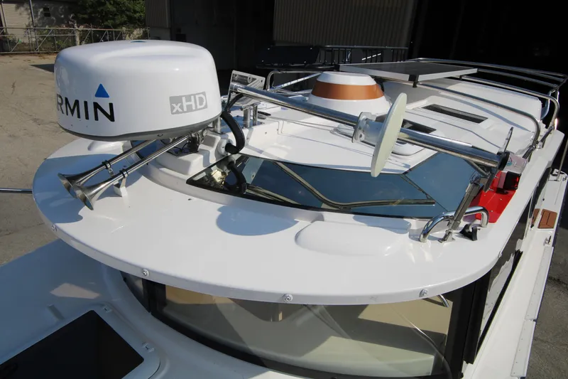 Slide: The Image of 2023 Ranger Tugs R-27 Luxury Edition with Garmin radar and advanced navigation equipment. - 27