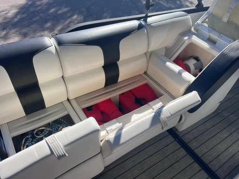 Slide: The Image of 2020 Montara Surf Boss boat interior with storage compartments and life jackets. - 13