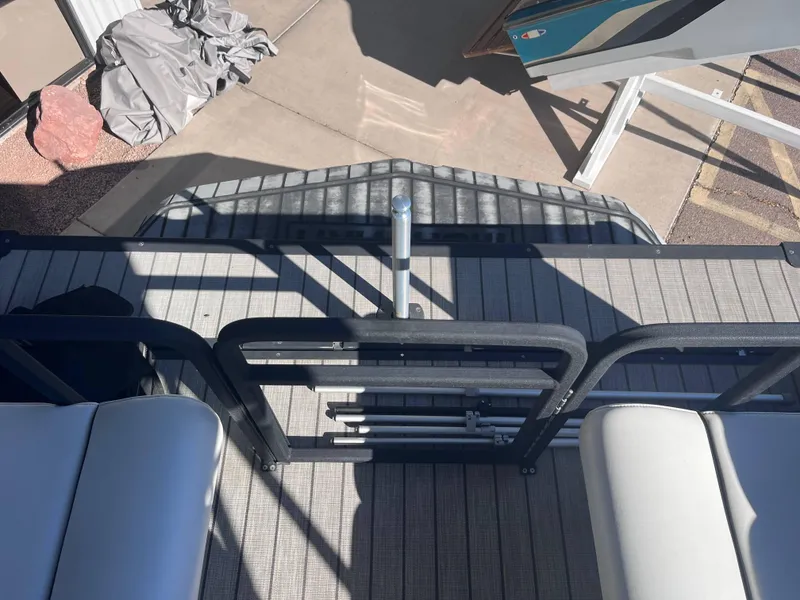 Slide: The Image of 2020 Montara Surf Boss boat deck with seating and railing in sunlight. - 14