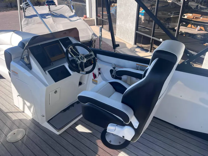 Slide: The Image of 2020 Montara Surf Boss boat cockpit with steering wheel and captain's chair. - 4