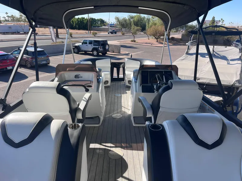 Slide: The Image of 2020 Montara Surf Boss boat interior with seating and steering wheel. - 7